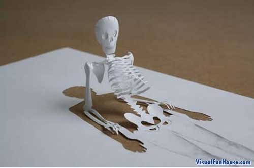 Skeleton Rising form the paper - paper art.